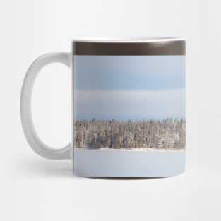 Lake landscape and forest island at winter day Mug